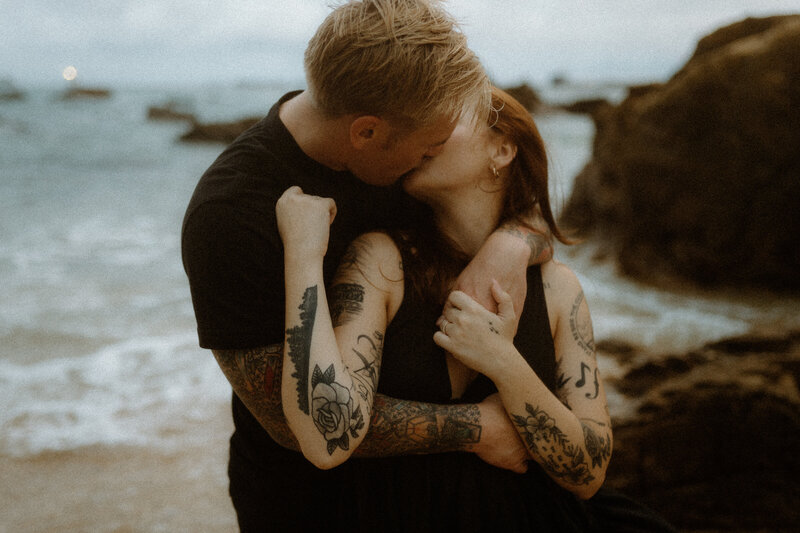 J moving A's hair to the side as he iis about to kiss her while they lay down