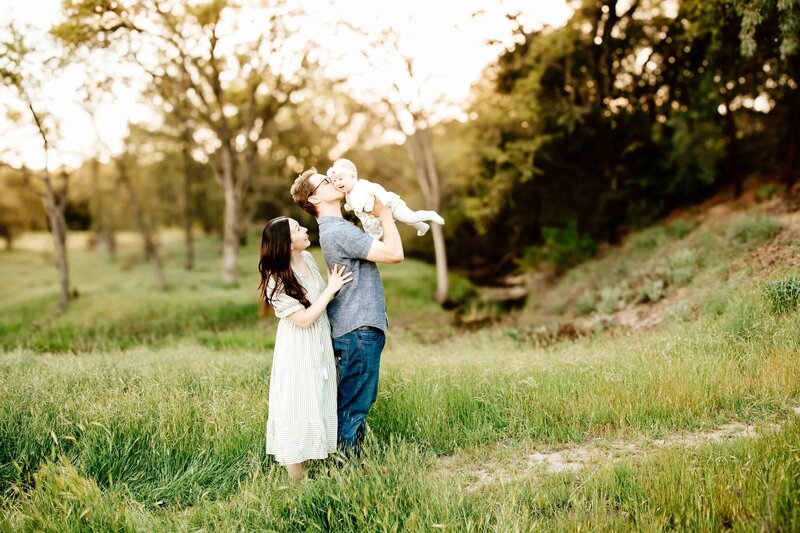 Mom and Dad holding baby during family photography session in San Luis Obispo