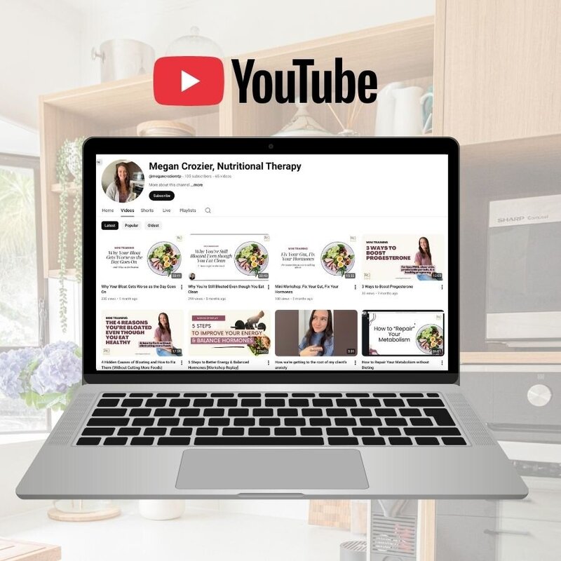 Modern kitchen with a clean countertop, stainless steel faucet, and a vase of fresh flowers, symbolizing a calm, nourishing home environment.