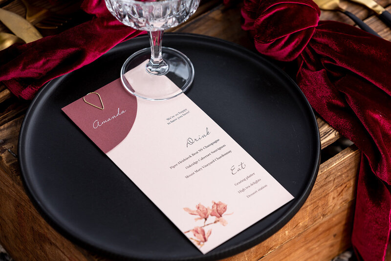 Pink wedding place card and menu with magnolia floral design