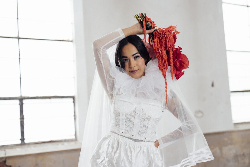 modern-bride-posed-with-flowers