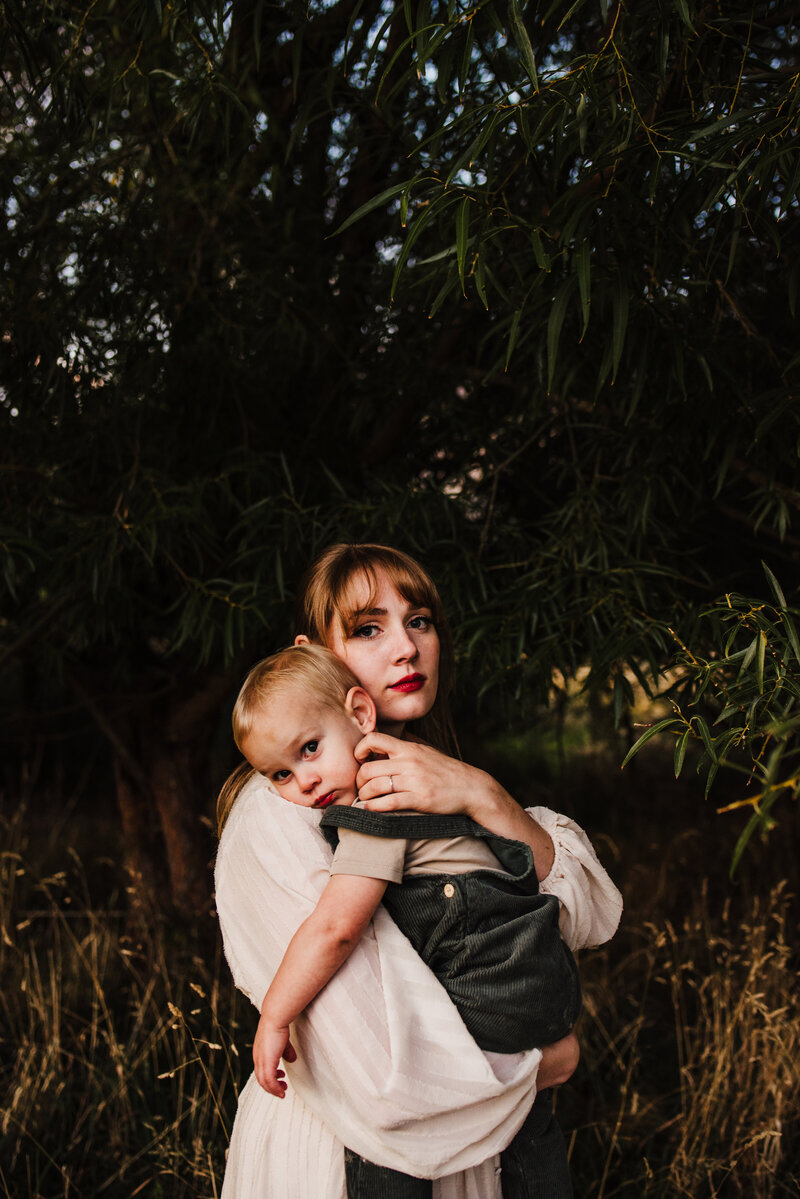 Utah mom holding toddler boy wearing boho clothes