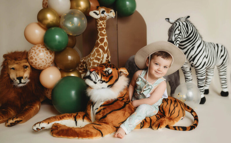 Family Poses with their Infant during Newborn Photoshoot in Asheville, NC.