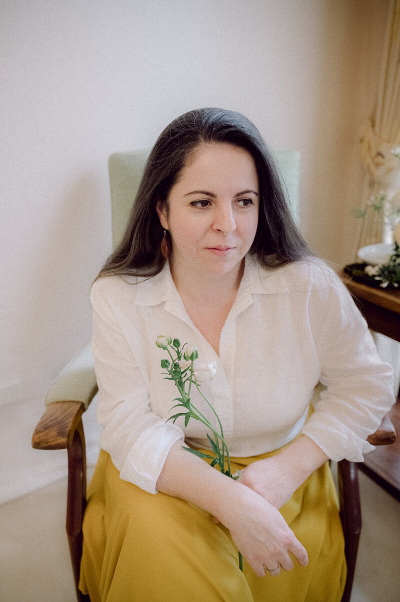 Andreea Bucur-Teastyle Studio Brand Creative Director and Business Coach Portrait holding a flower