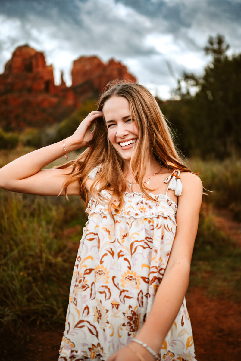 Highschool senior celebrating graduation in the red rocks of sedona by annie bee photography.