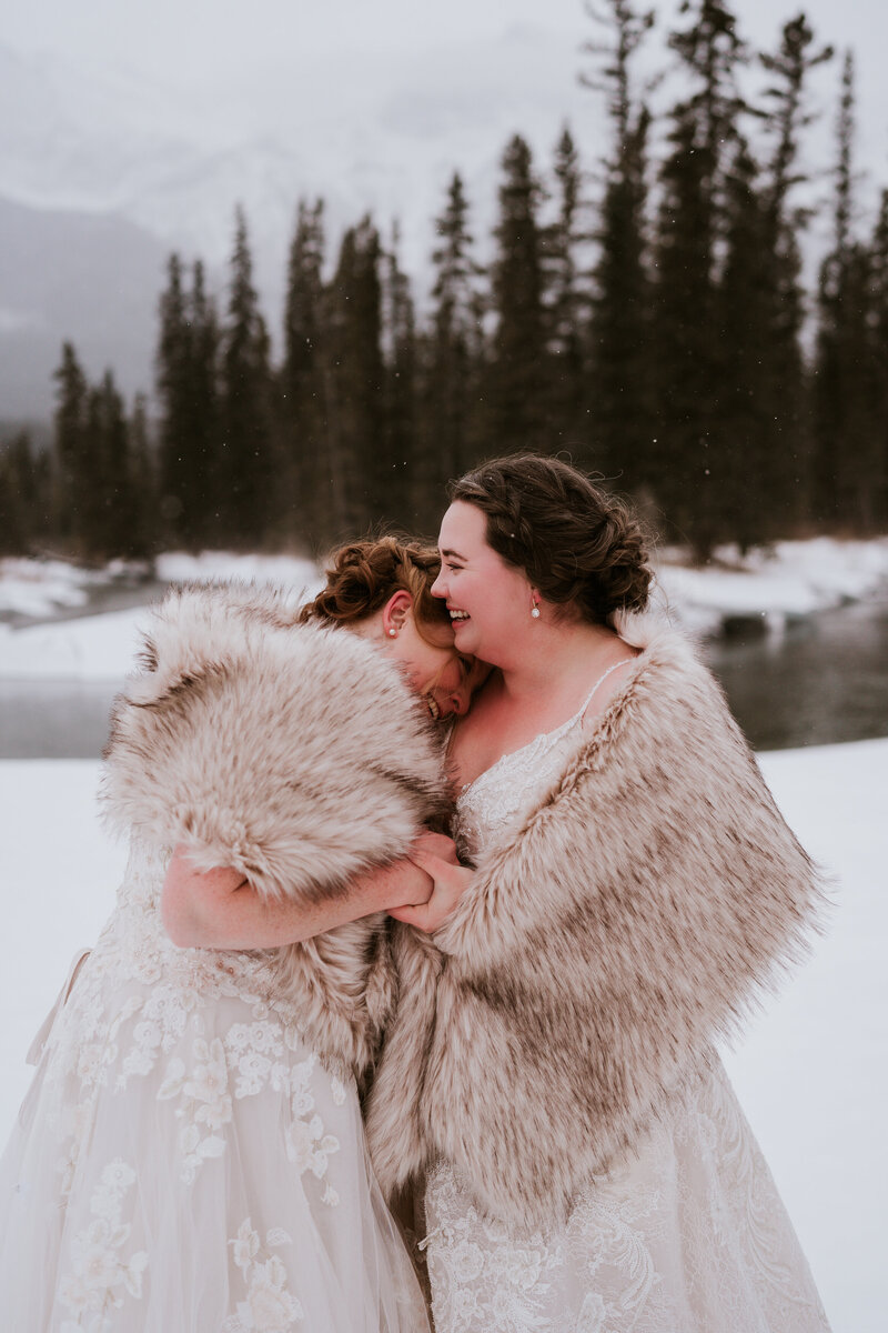 Same sex couple having a winter elopement in Canmore
