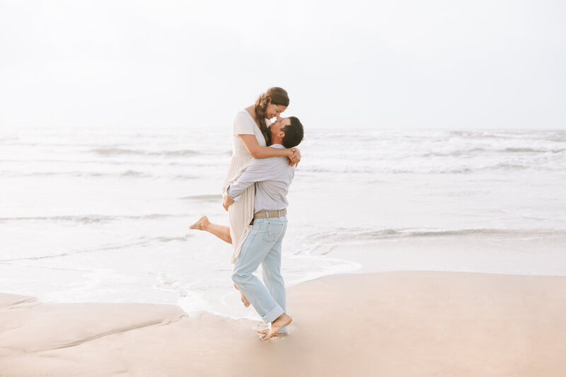 Couple taking romantic photos on the beach in Port Aransas Texas