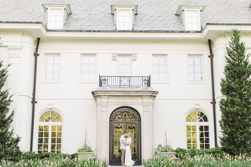 couple standing in front of a building