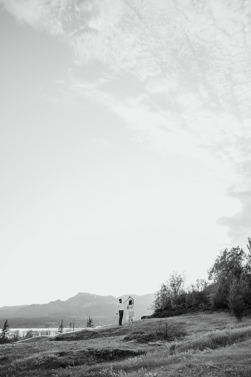 bride and groom kissing in a grassy area