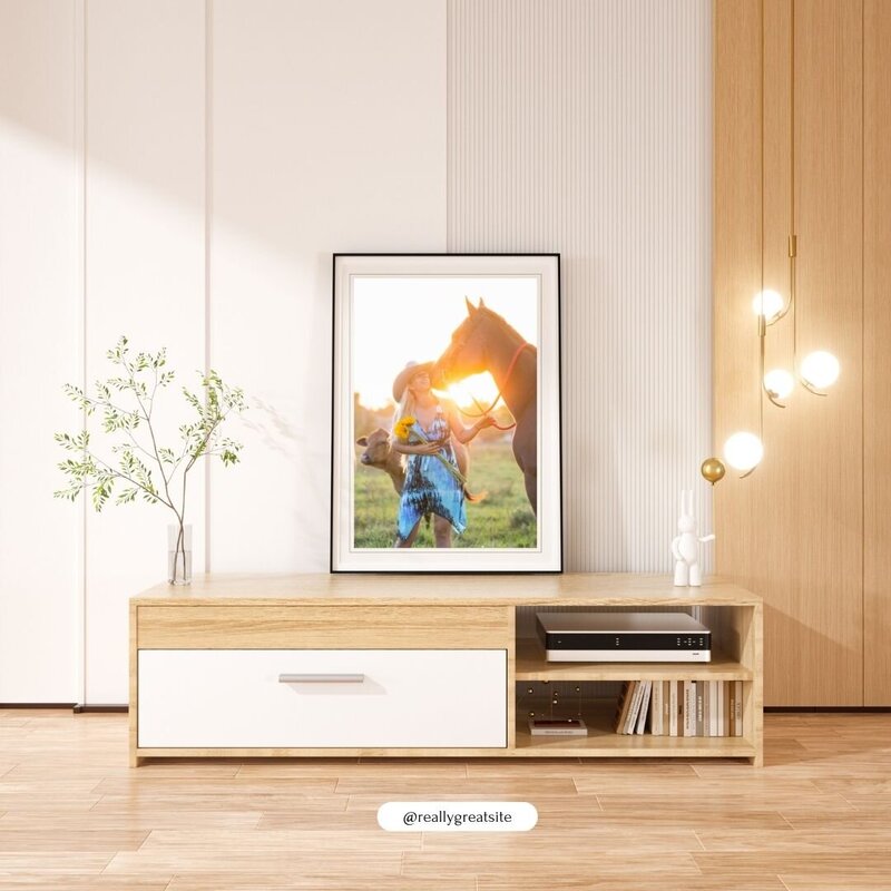 wall art mockup of a girl kissing her horse's nose in front of the sunset with cows in a field behind them