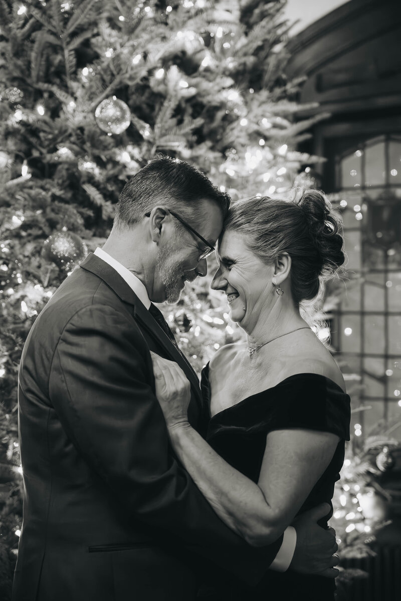 woman holding husbands face