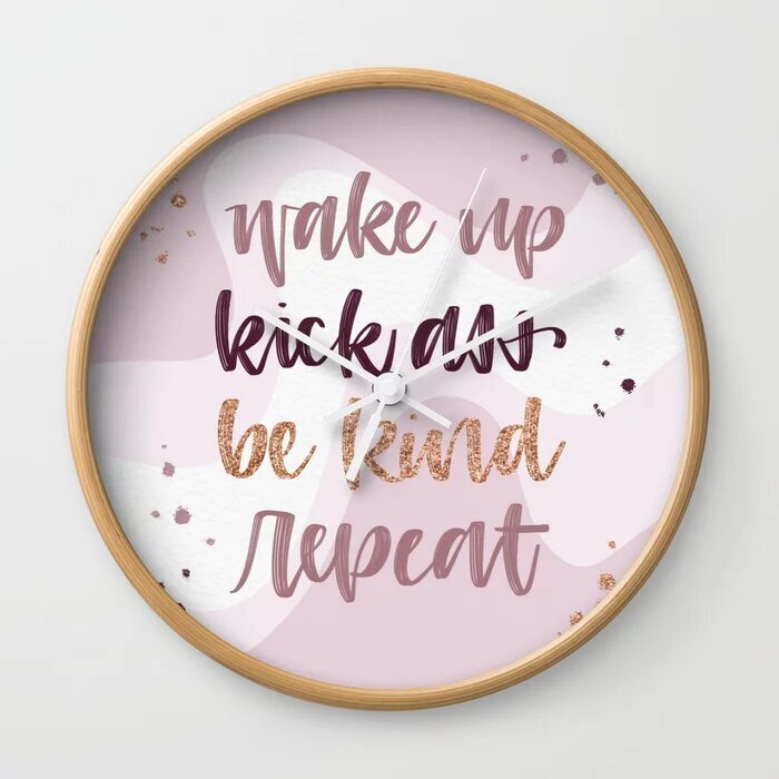 Clock with custom hand lettered text "wake up, kick ass, be kind, repeat
