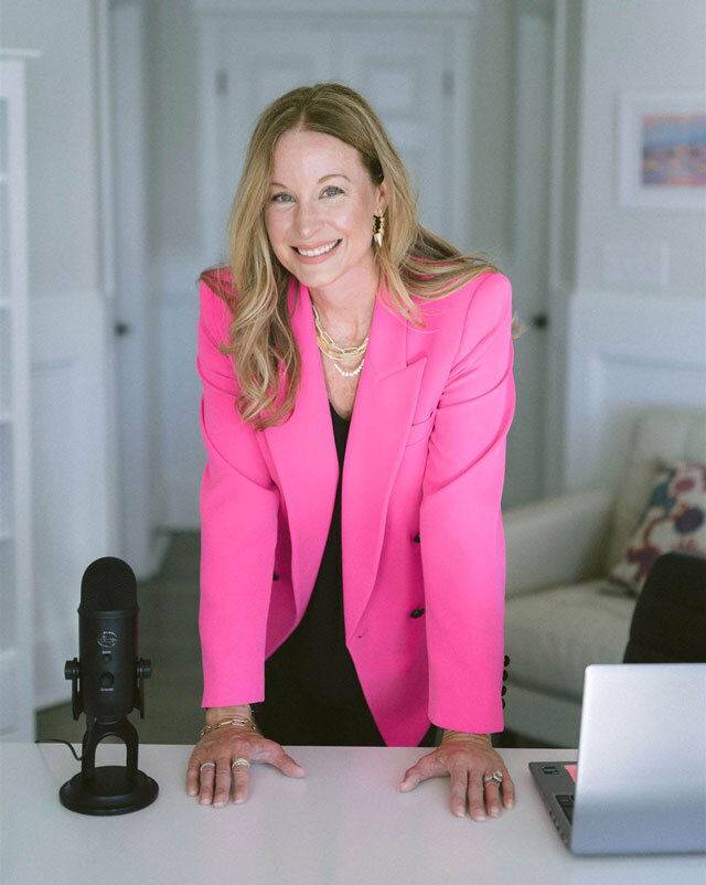 April Likins, top stress and work life balance coach with hands on her desk