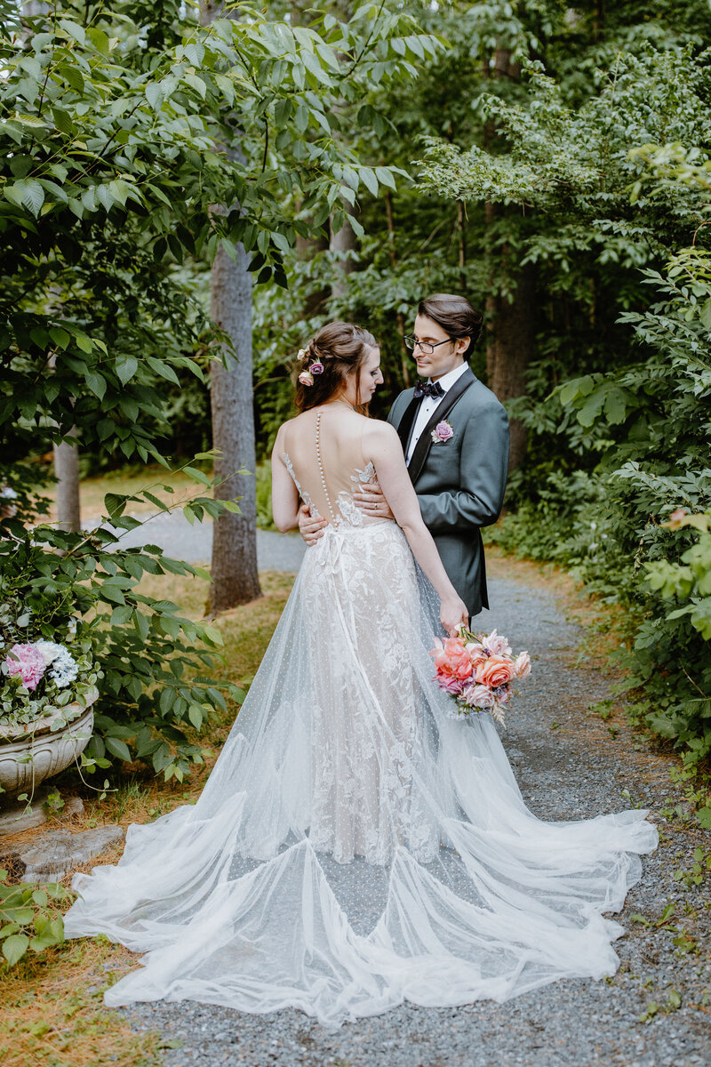 Bride and groom in an editorial pose for their wedding portraits for their Vermont wedding.
