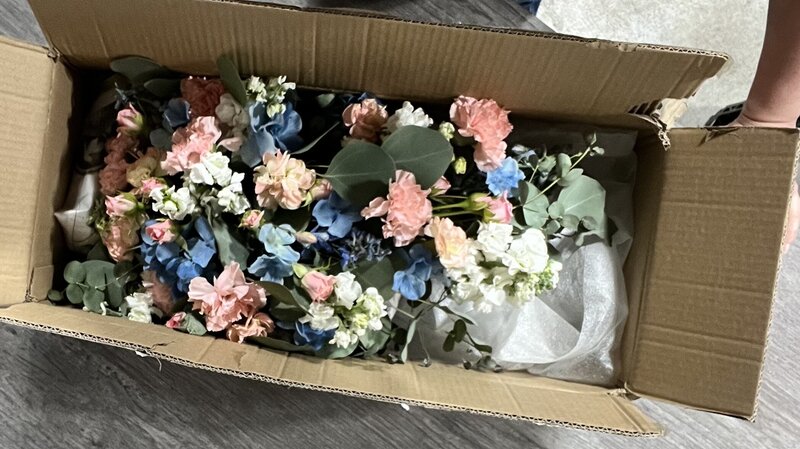 white lilies peach roses green hydrangea funeral casket flowers at White Pine Funeral Flowers 