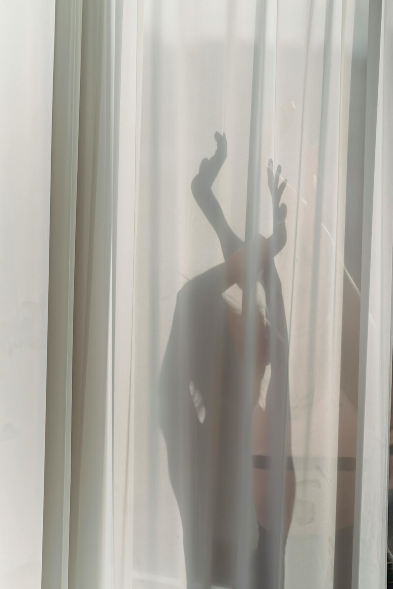 woman standing in hotel lobby in front of an elevator