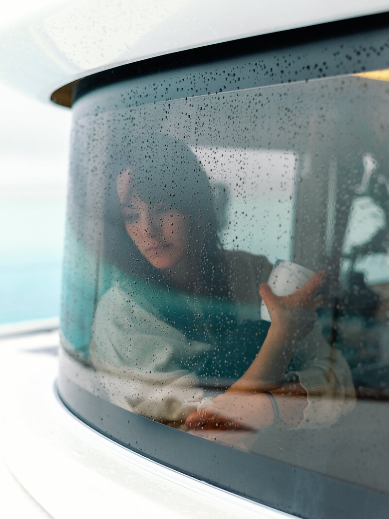 Portrait under the rain on the boat
