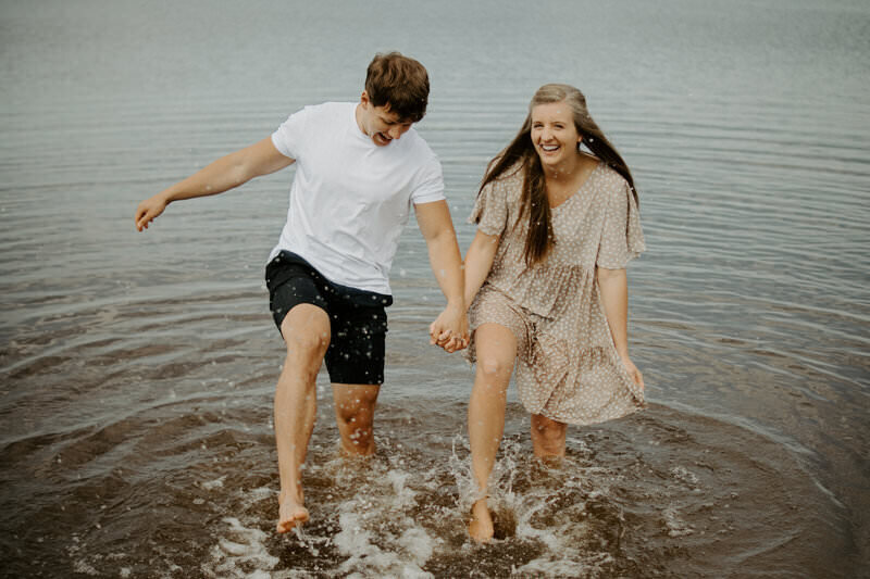 couple in water on beach