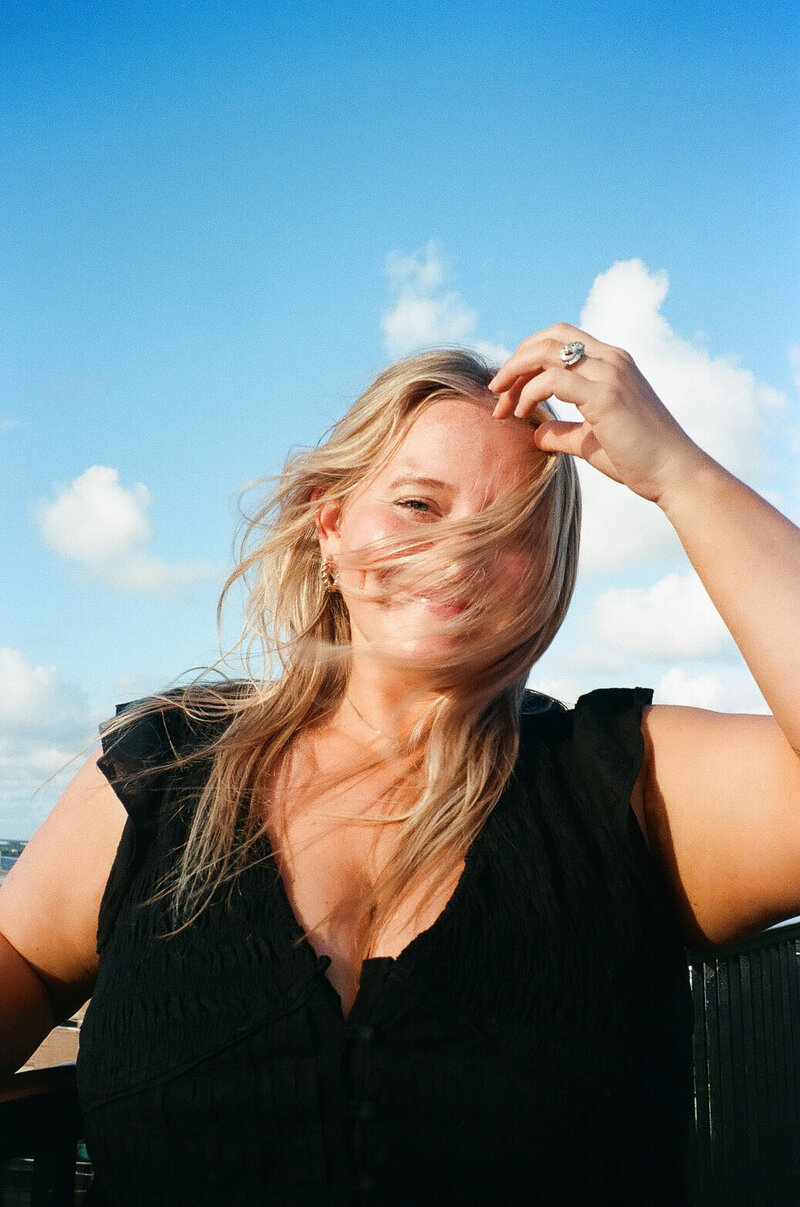 Photographer holding camera gear during a wedding day in Georgia.