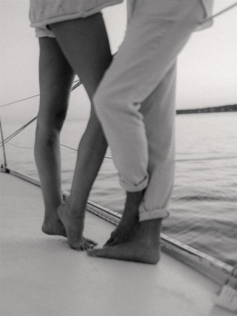 black and white image of engagement session on a boat