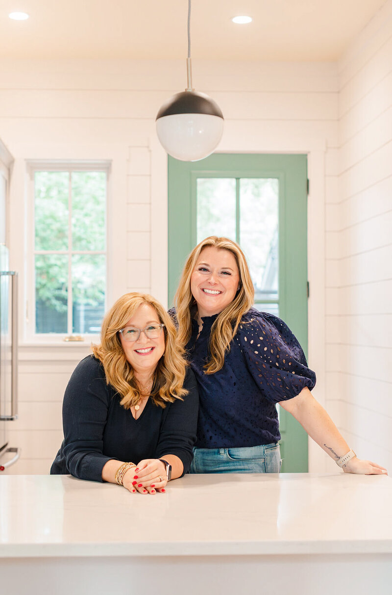 melissa and corry standing next to each other smiling at camera looking super profesh