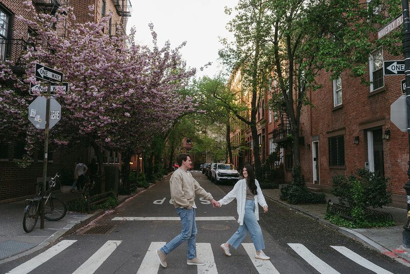 couple walking in NYC engagement photos, captured by Elsie Goodman, an NYC engagement and couples photographer
