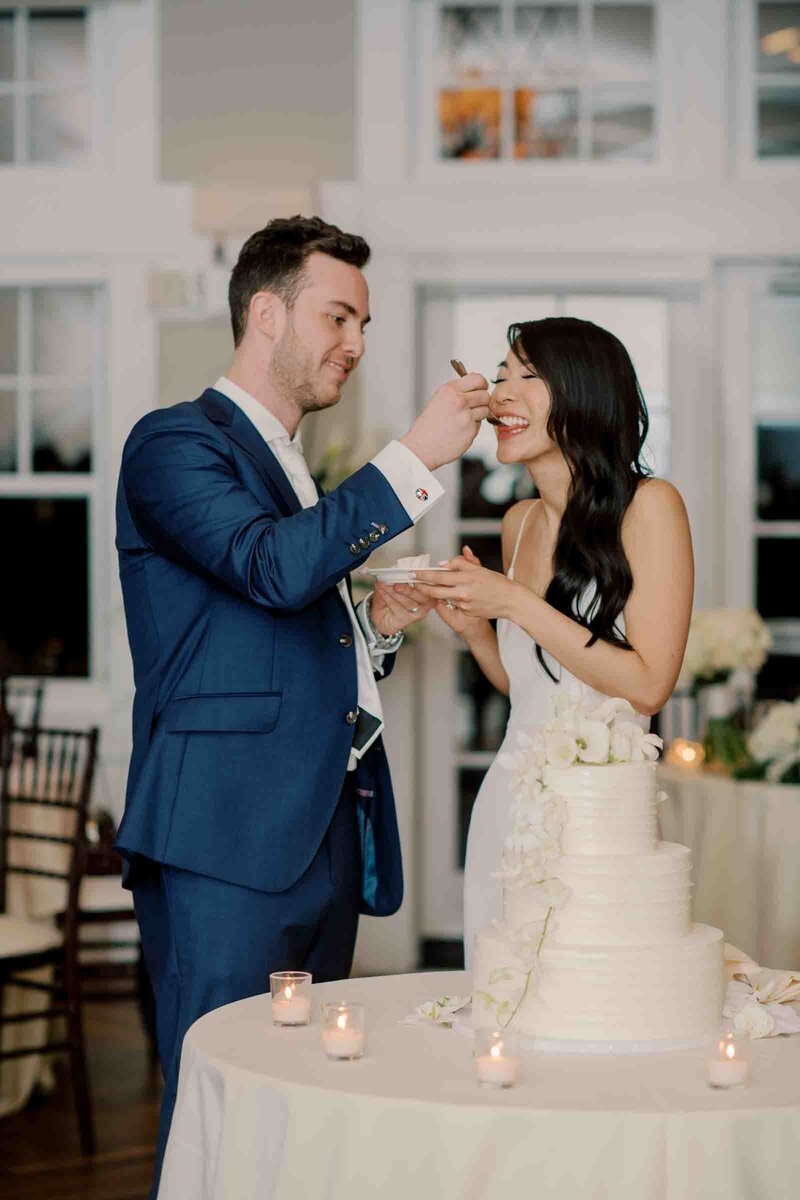 wedding photographers virginia photo of a couple eating their wedding cake
