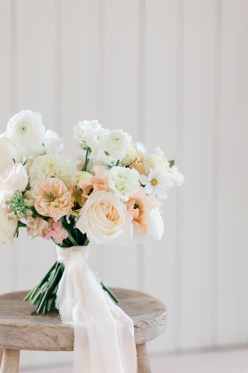 Carbis Bay wedding, white and lilac flowers cascading over the tables with silver candelabras. Flowers include alliums and orchids