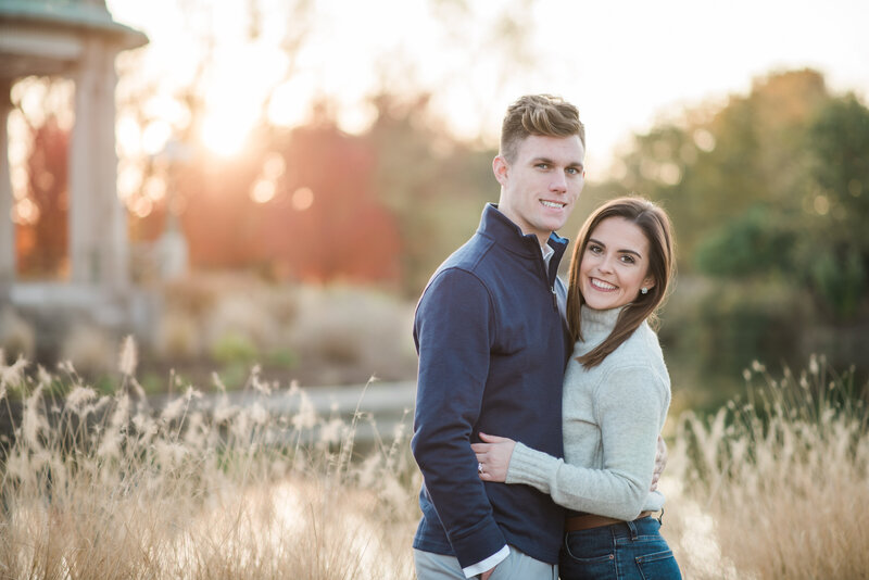 beautiful fall engagement in forest park at sunset