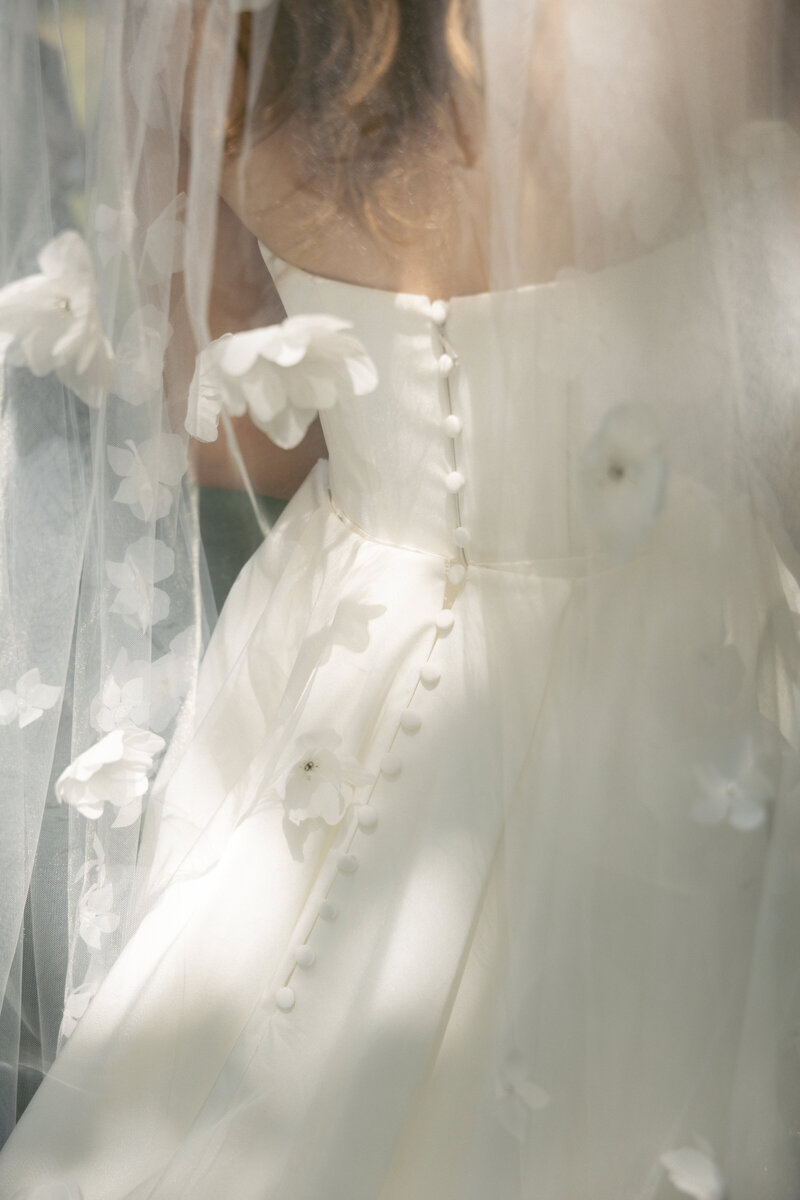 Portrait of a bride with her veil over her face