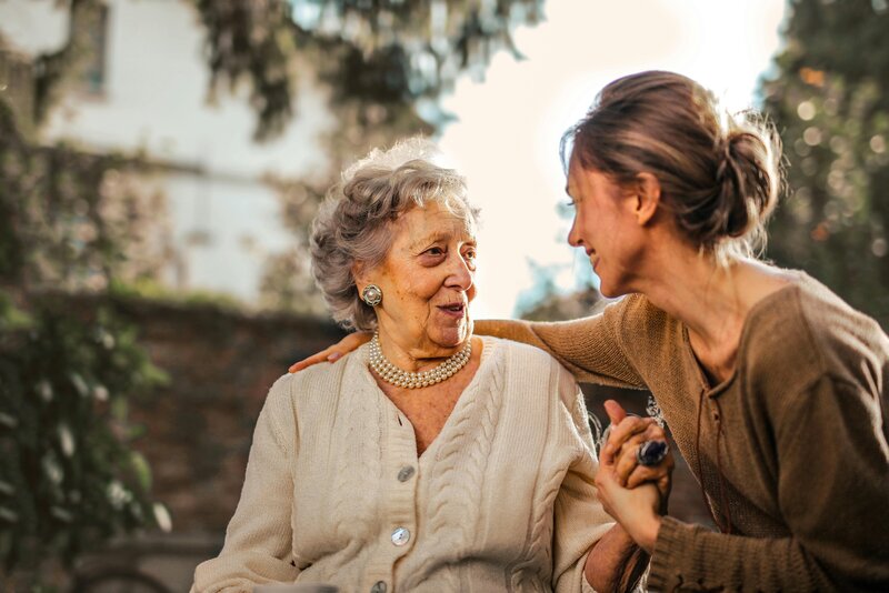elderly woman and adult daughter