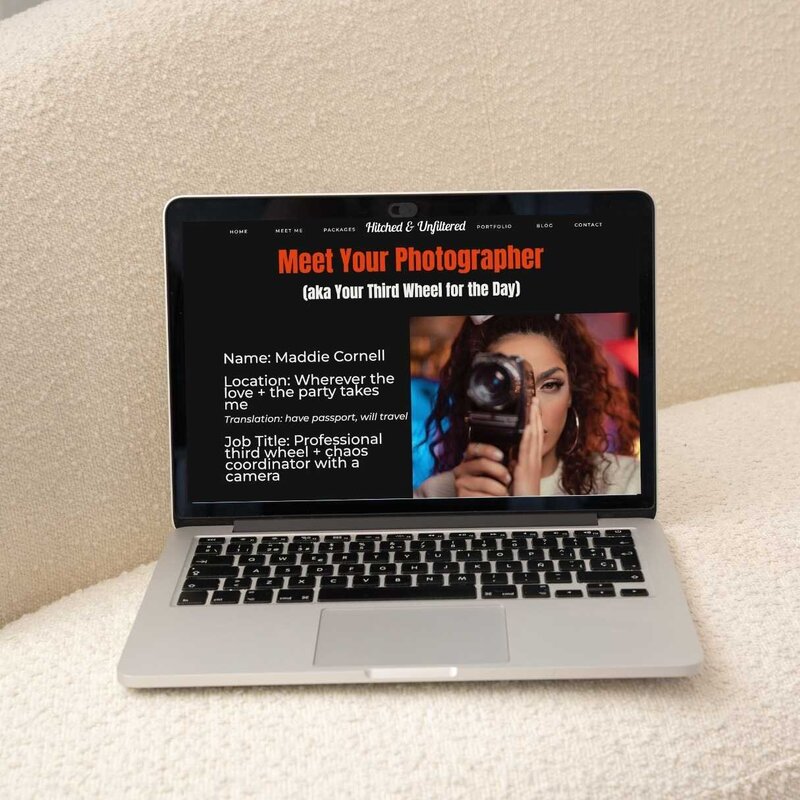 A laptop on a cream coloured couch with an about page of a website displayed