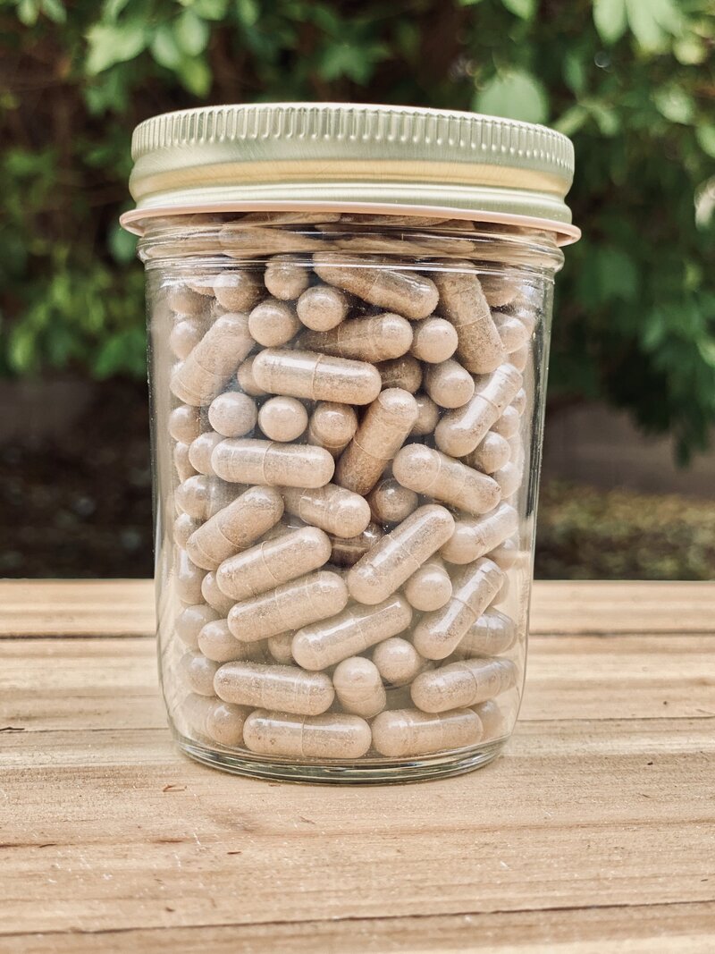 Capsules of dried placenta in a jar