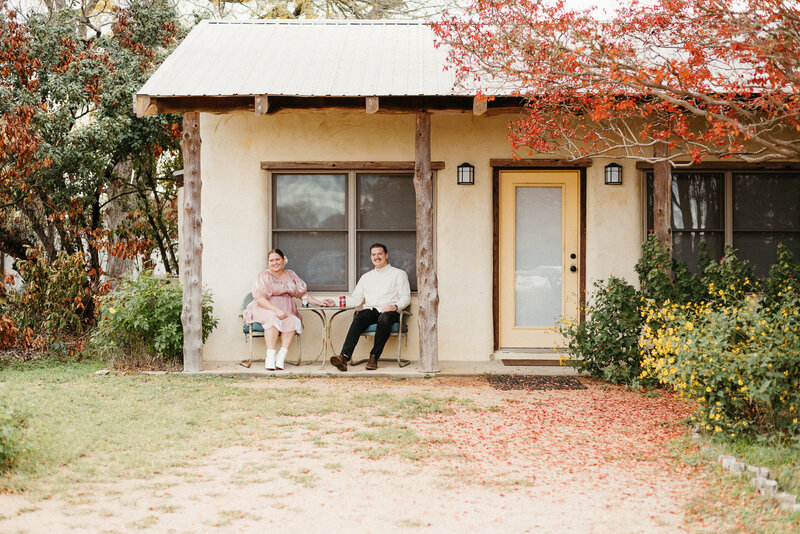 Couple sitting on porch at Hudson Bend Ranch