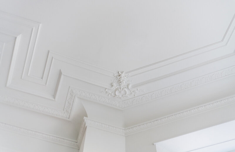 Hand cast plasterwork with cartouches in Maison Commonwealth townhome