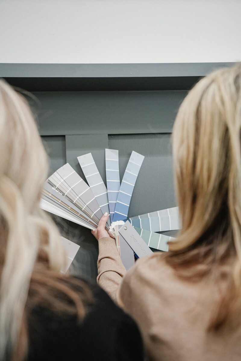 2 women looking at color swatches