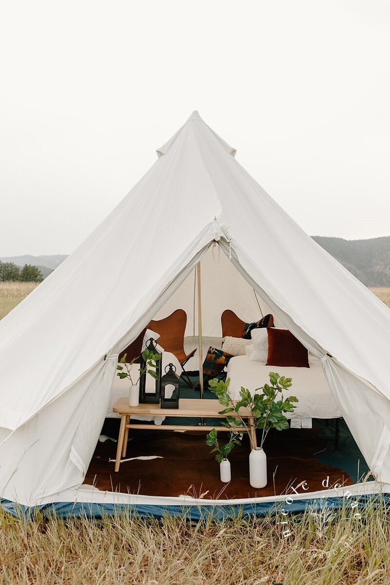 Canvas Bell Tent Exterior View with twin size beds, decorations and black lanterns