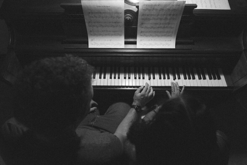 Couple playing in the snow in Missouri during engagement session