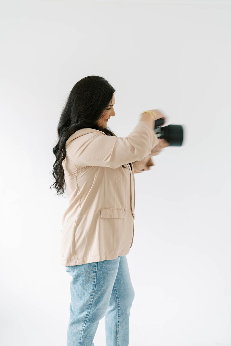 photo with motion blur showing Anna taking a picture using her camera