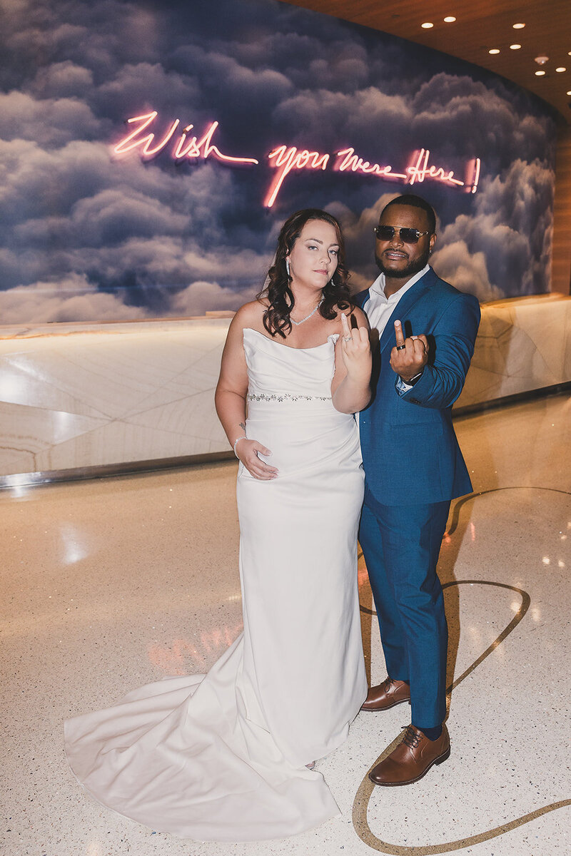couple poses for pictures after las vegas elopement ceremony