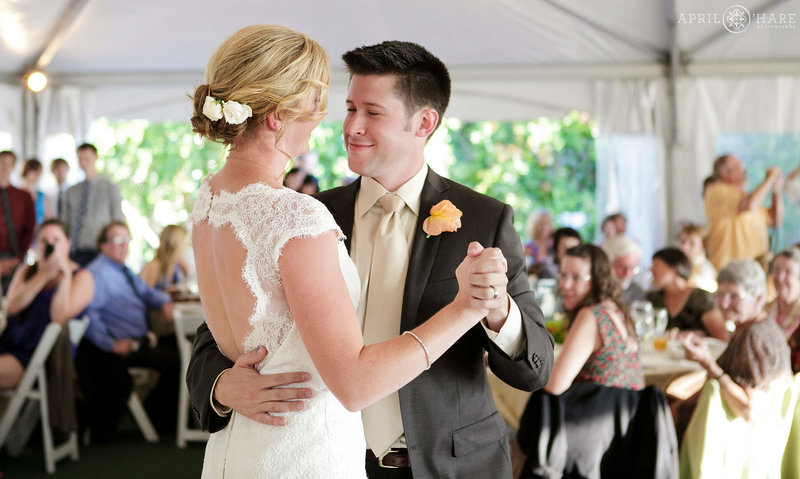 Couple dances their first dance inside the tent at Bella Vista in Steamboat Springs