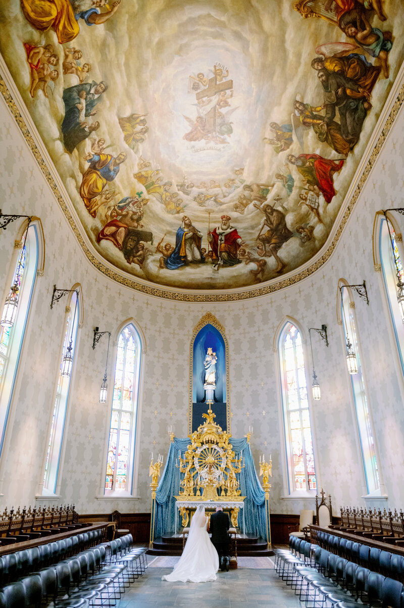 an ornate ceiling in a Catholic church