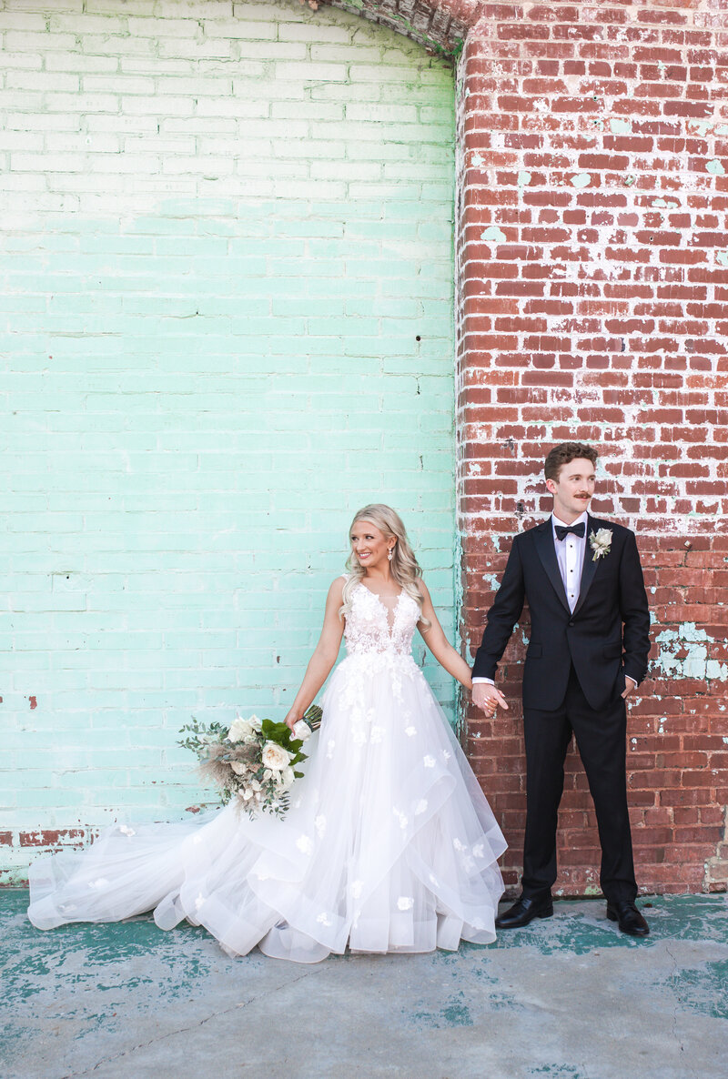 Bride and Groom holding hands
