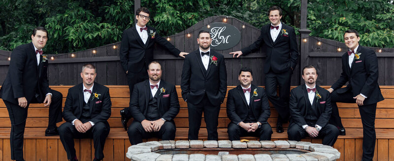 Groom and groomsmen posing on rustic patio | Hamilton Manor Wedding | Hamilton Township, New Jersey