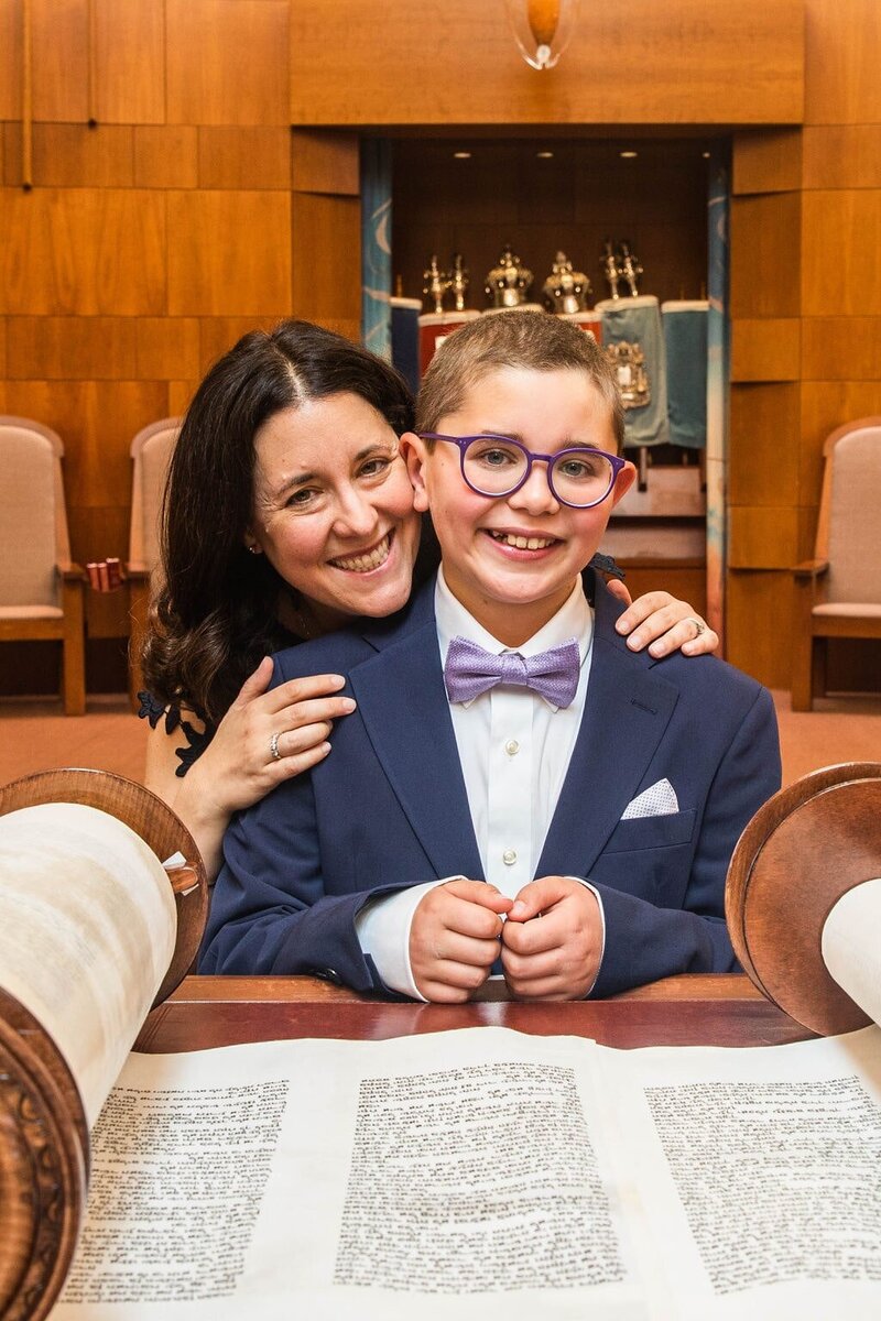 Mother and Son from a Temple Emanuel Bar Mitzvah in Newton MA on the bimah with the torah.