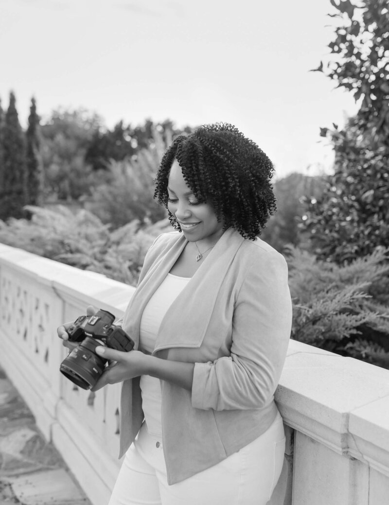 Photographer Lisa Yvette Holding Her Camera