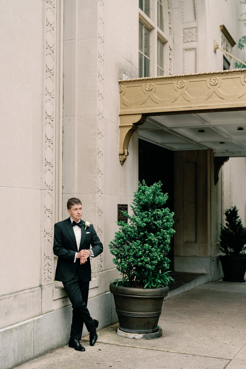 Groom outside of the John Marshall Hotel
