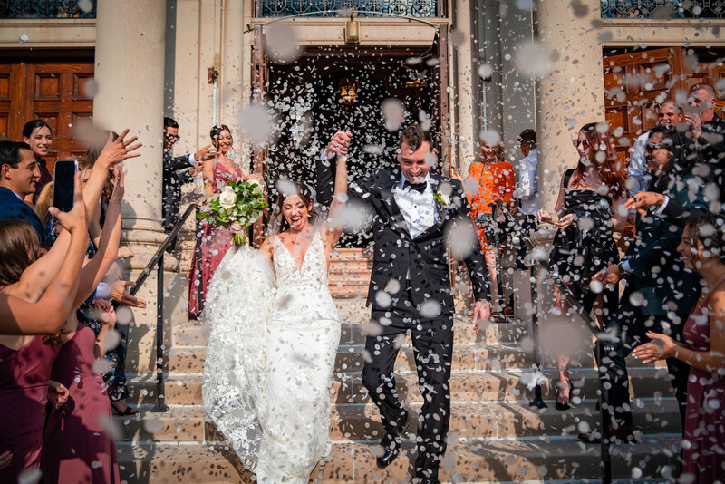 Just married couple on stairs of Assumption Greek orthodox church Chicago