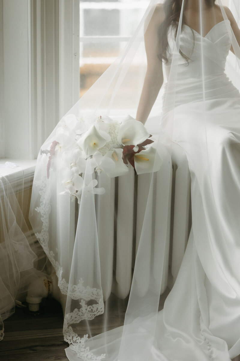 bride holding bouquet on wedding day in pei