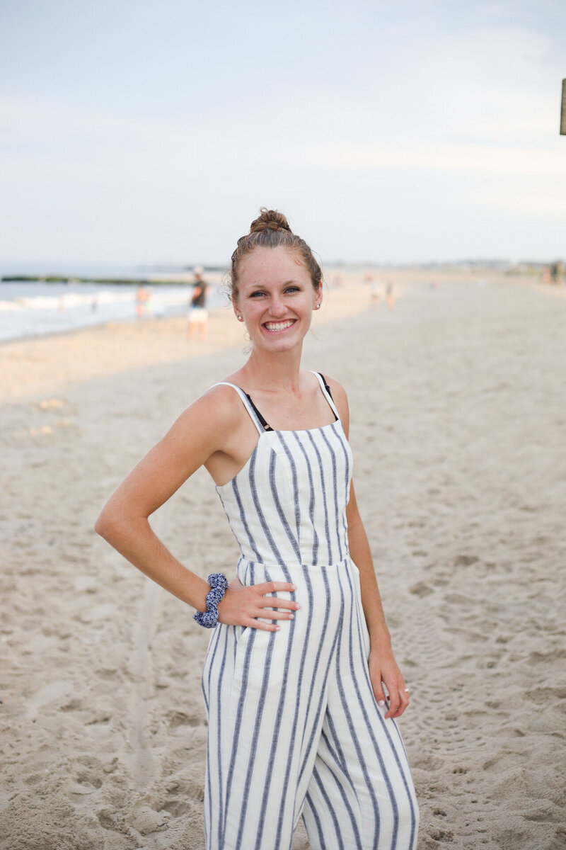 Headshot of Liz on the beach smiling at the camera